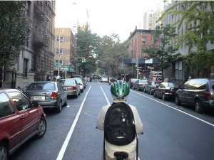 Here's a bicyclist going the right way in a bike lane on one-way East 91st Street in Manhattan. Hint to other cyclists - if you're in the bike lane and all the cars are pointed toward you, YOU'RE GOING THE WRONG WAY! (photo by bicyclesonly/Flickr)